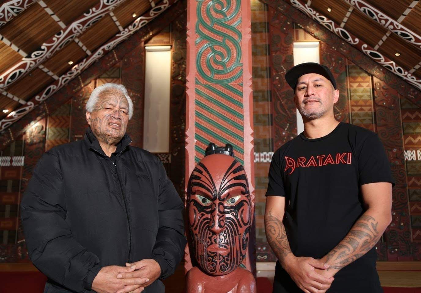 Lee Timutimu standing next to his Uncle Joe Harawira at their ancestral whare Mataatua in Whakatane